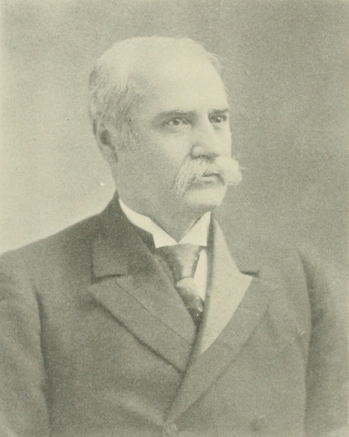 Photographic portrait of Senator Nelson W. Aldrich in dark suit, head and shoulders